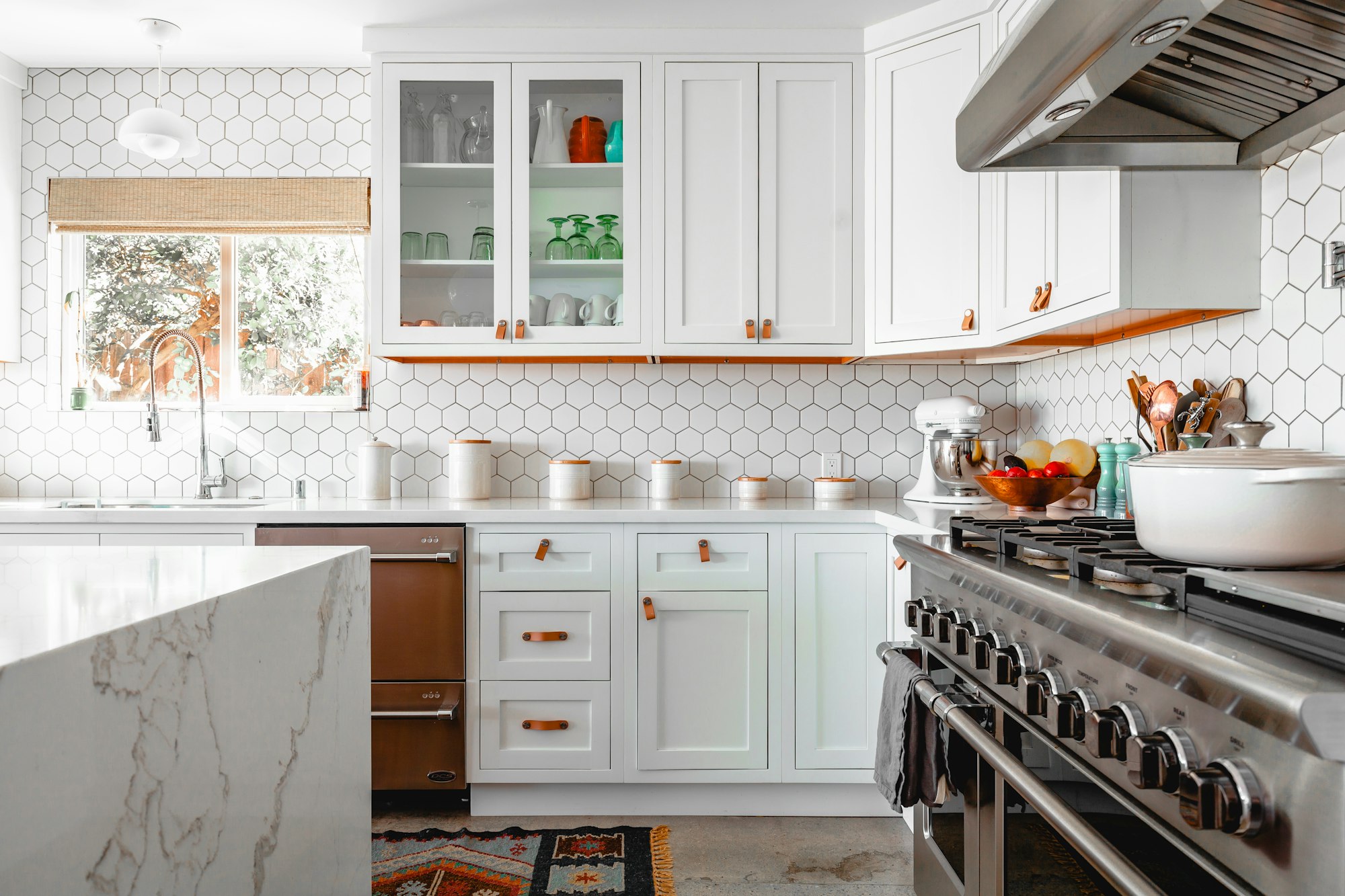White shaker kitchen with quartz island — Westchase